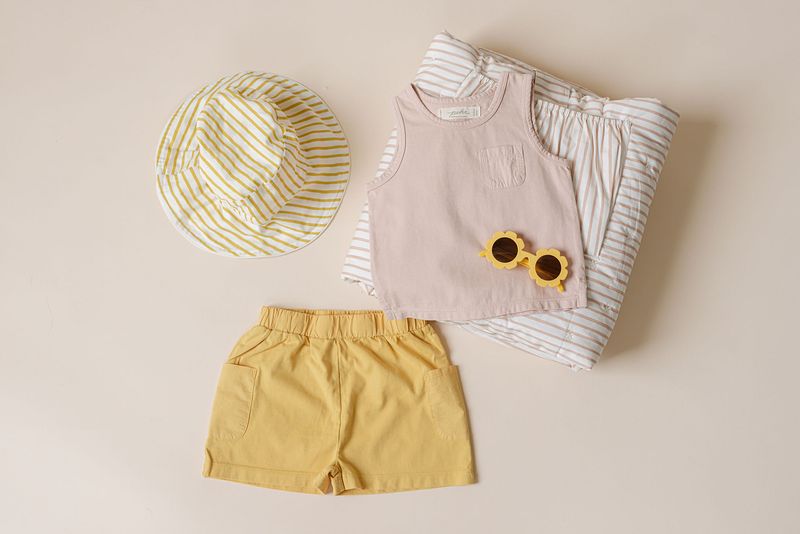 Flatlay image of Pehr summer clothing for toddlers