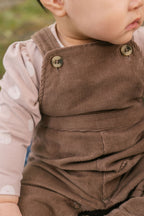 corduroy overall portobello in neutrals pattern up close on model with buttons