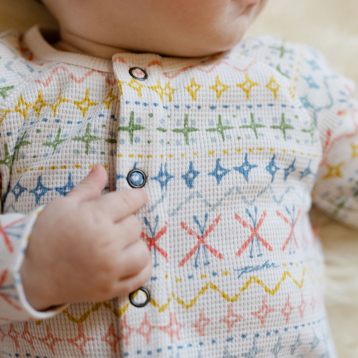 Petit Ski Raglan Romper - Snow Patrol- On Baby- Up Close Snap Buttons- Colorful Print