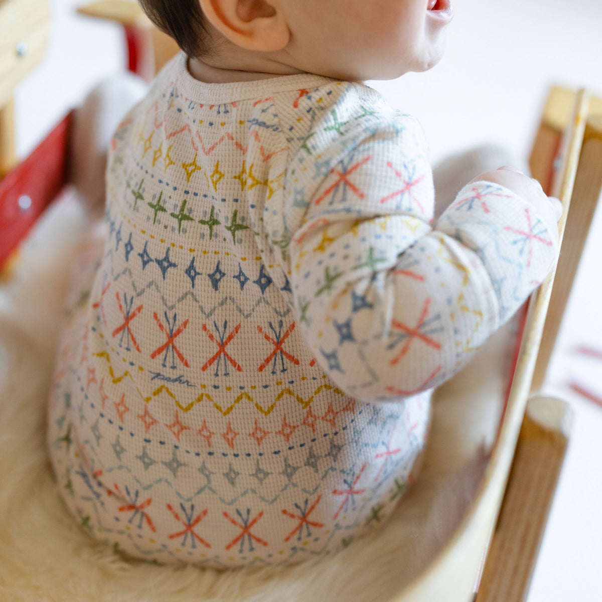 Petit Ski Raglan Romper - Snow Patrol-Back of Baby- - Colorful Ski Print