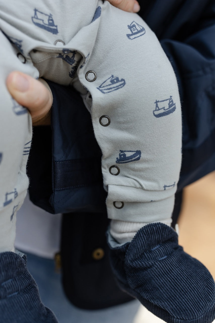Essentials Henley Patch Pocket Romper - Tugboat- Up Close On Baby- Leg Snap Buttons