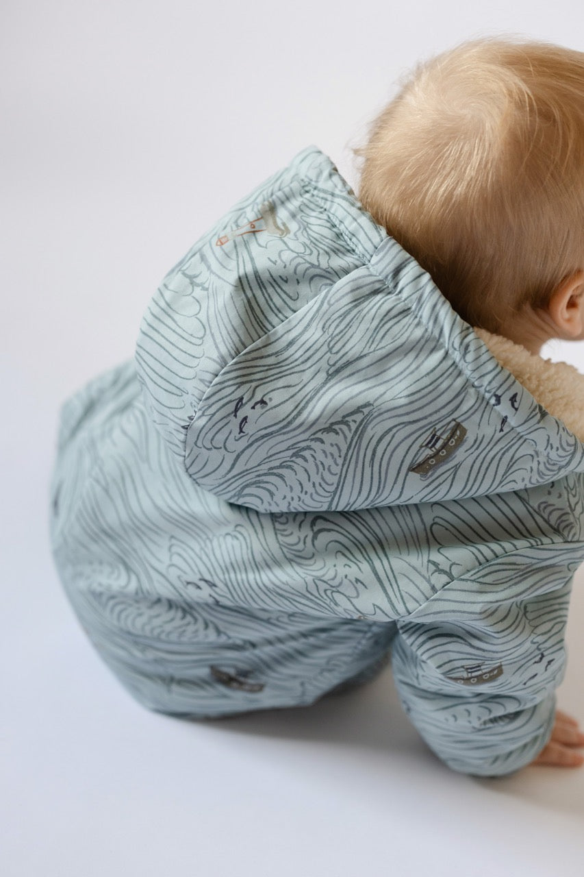 Sherpa Lined Storm Suit - High Seas - Blue- Back of Baby- Hood- Rolling Seas Print