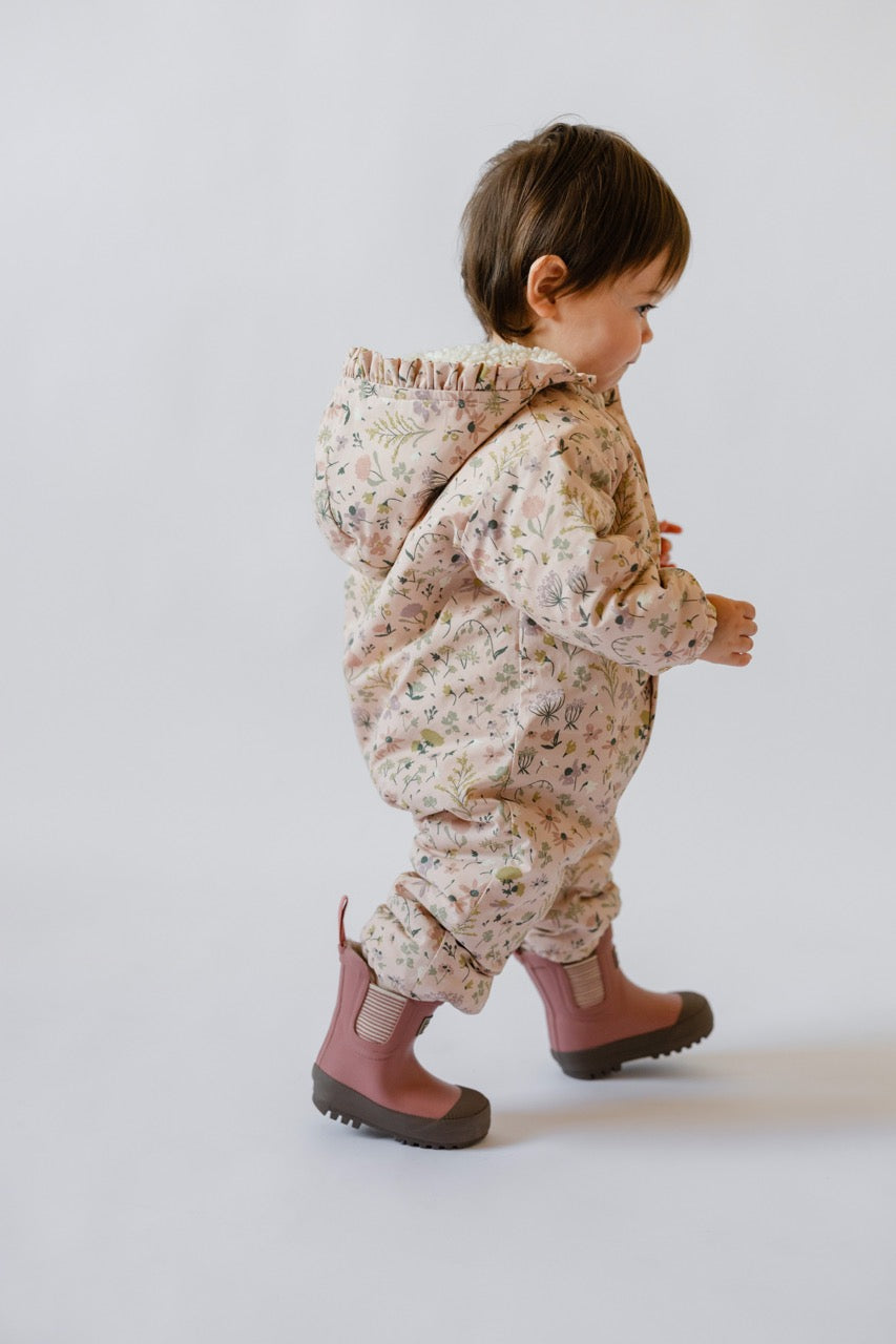 Sherpa Lined Storm Jacket with Ruffles - Wildflower- On Baby- Side- Pink Florals- Hood Ruffle