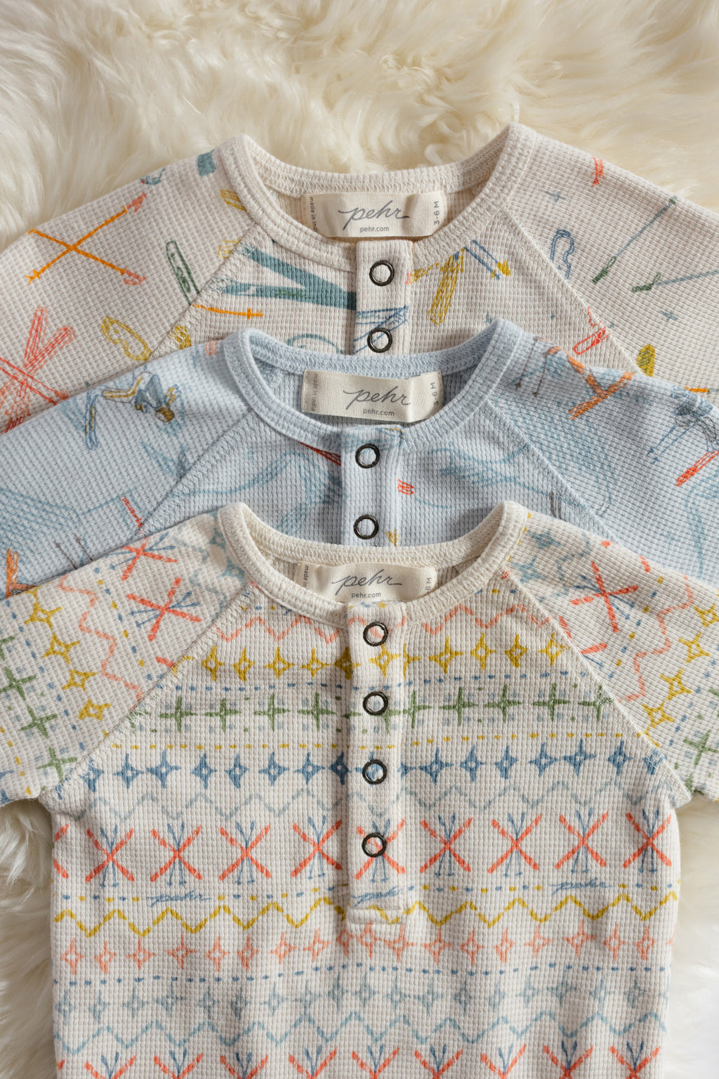 Petit Ski Raglan One-Piece - Collection Flat lay