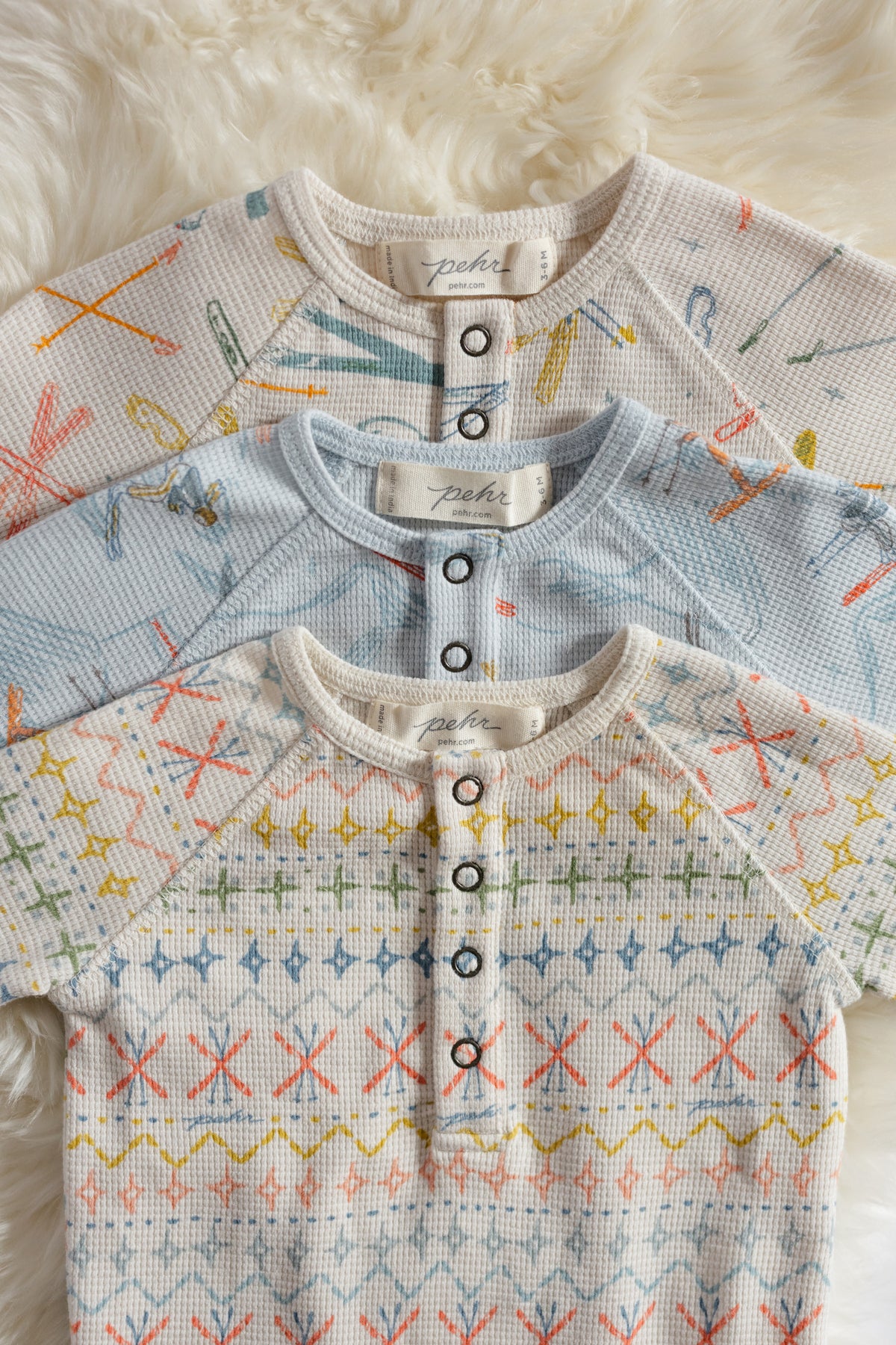 Petit Ski Raglan One-Piece - Collection Flat lay