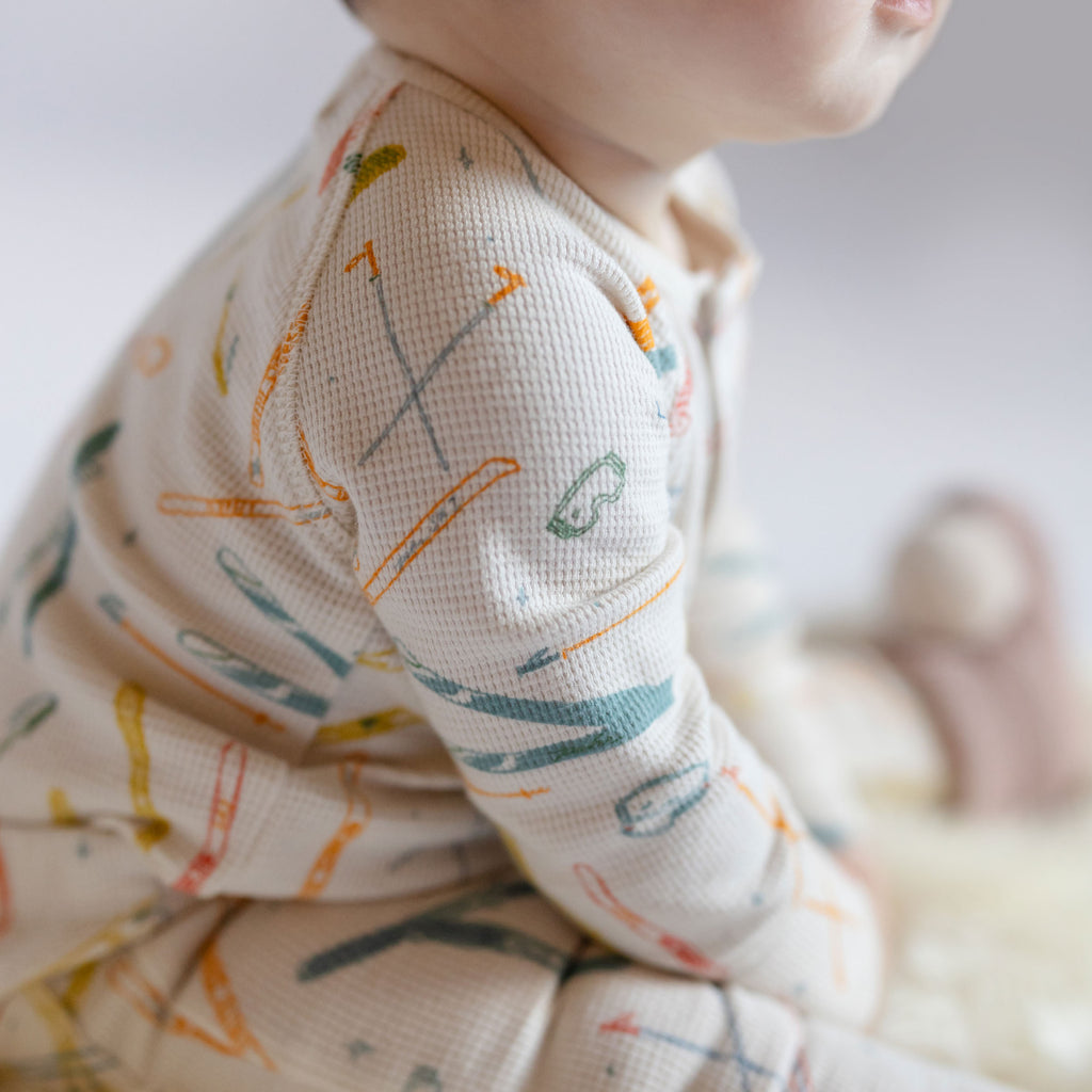 Petit Ski Raglan One-Piece - Apres- Up Close Baby- Colorful Ski Print- Arm
