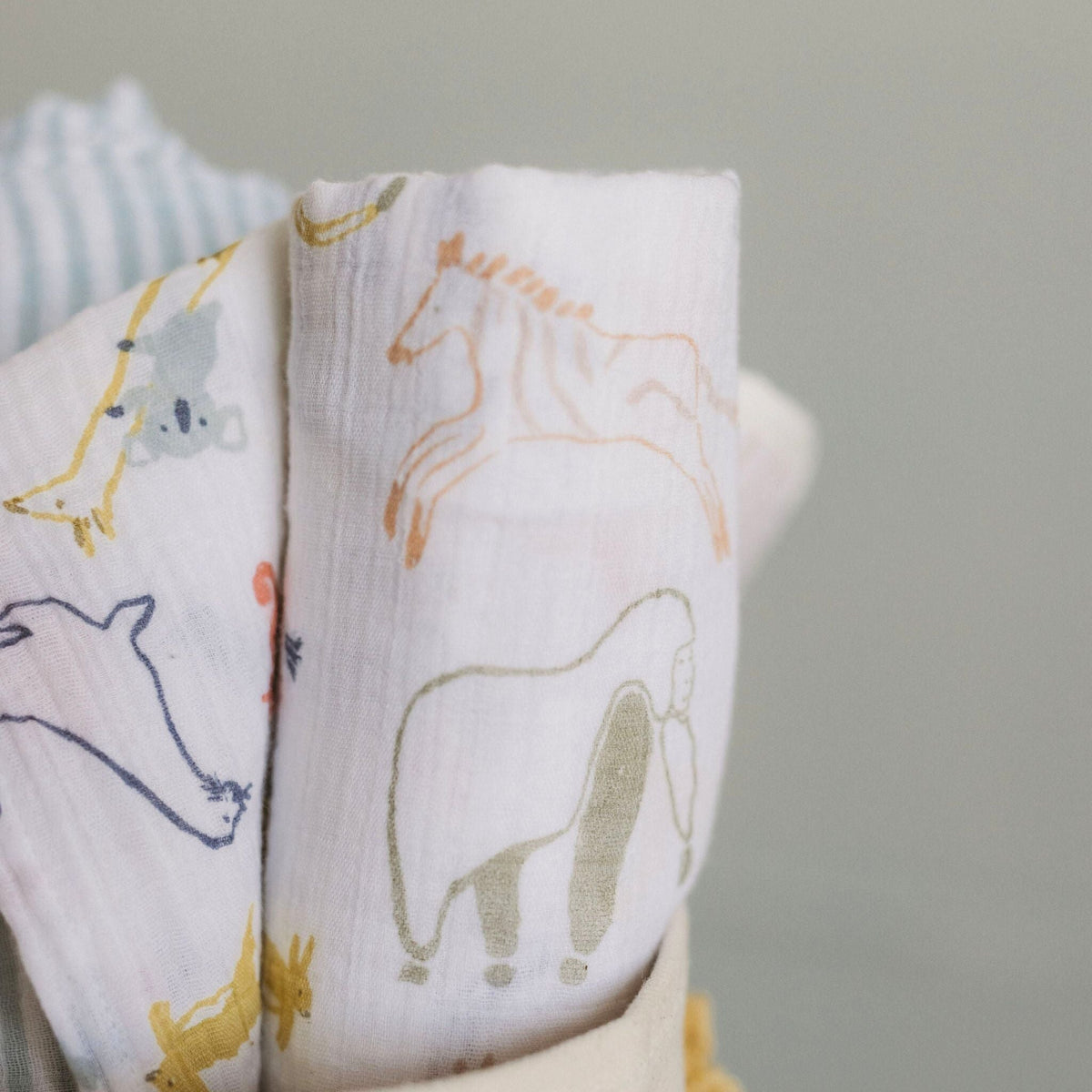 organic cotton muslin swaddle into the wild