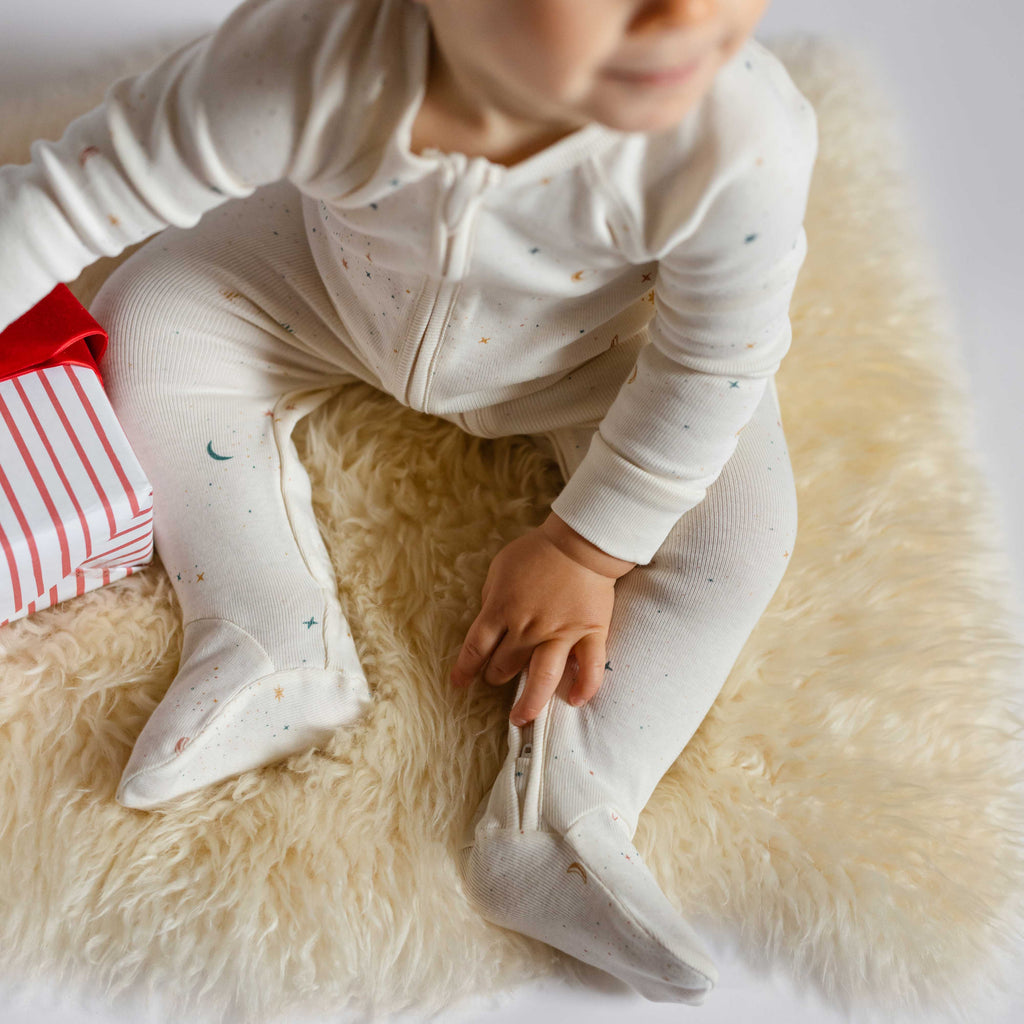 Ribbed Baby Sleeper - Celestial- On Baby- Holding Gift- Holiday- Footies