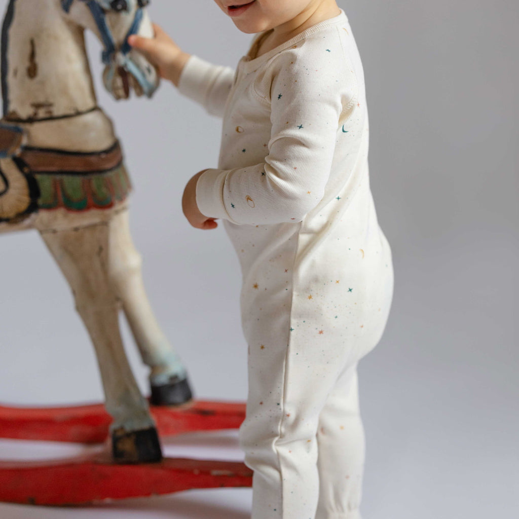 Ribbed Baby Sleeper - Celestial- On Baby- Holding Rocking Horse- Holiday