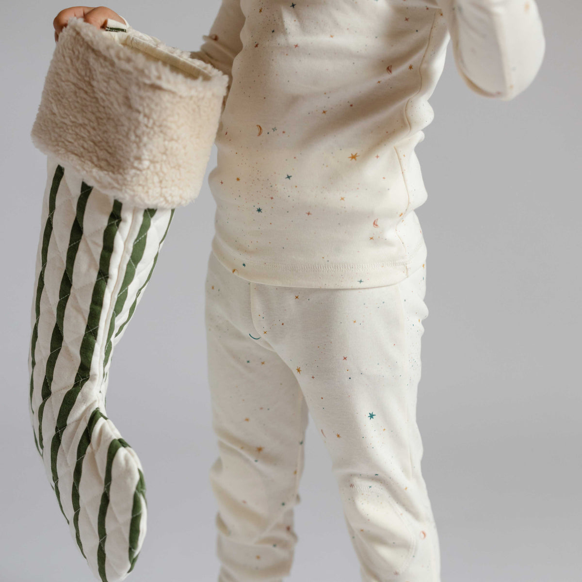 Ribbed Toddler Pajama - Celestial- Toddler Holding Stocking- White with Little Stars