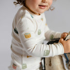 Ribbed Toddler Pajama - Little Drummer- On Toddler Up Close- White With Colorful Drums- Holiday