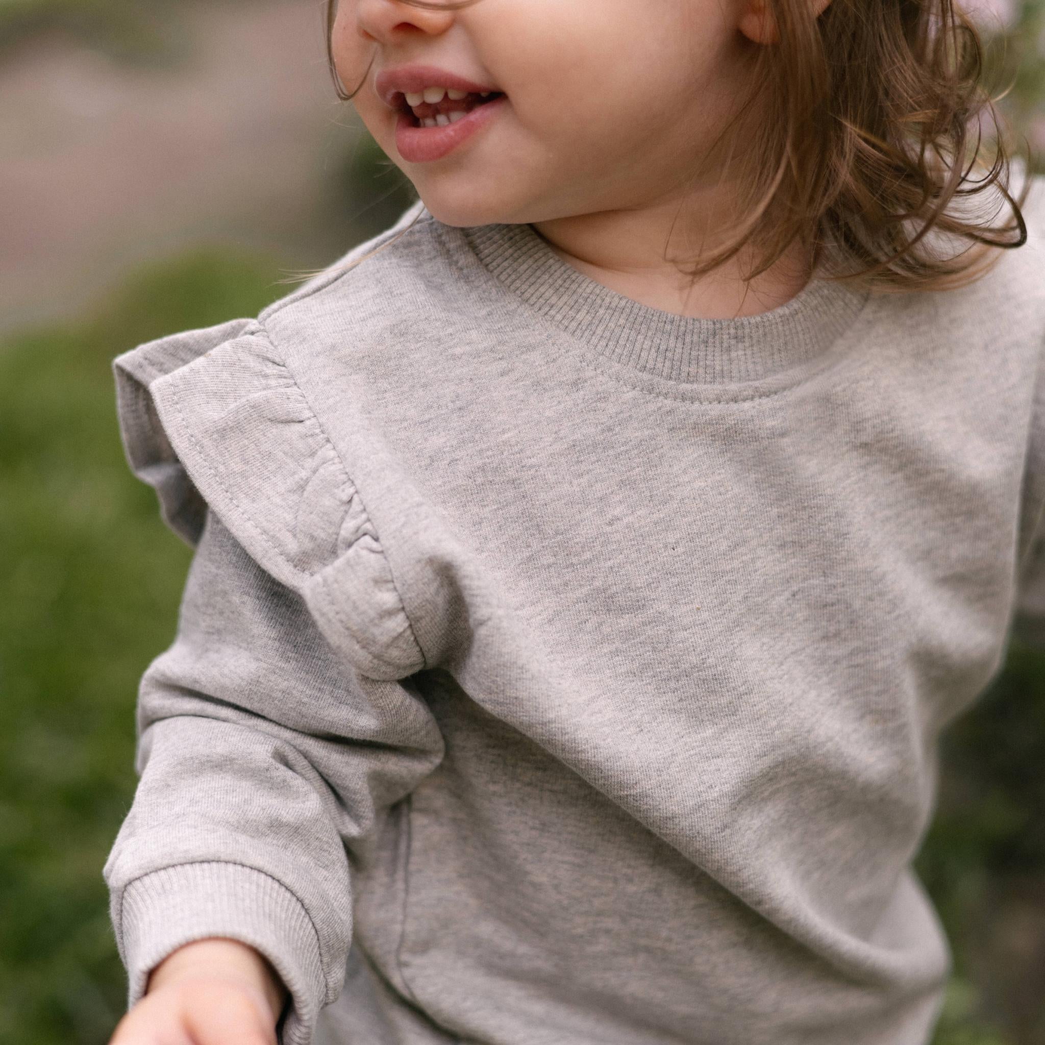 French Terry Toddler Ruffle Sweatshirt - Heather Grey- Front- Up Close- On Model