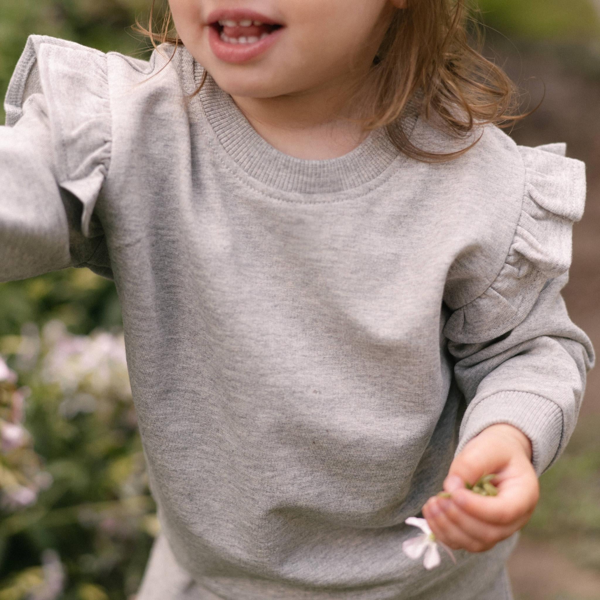 French Terry Toddler Ruffle Sweatshirt - Heather Grey- Front- Up Close- On Model