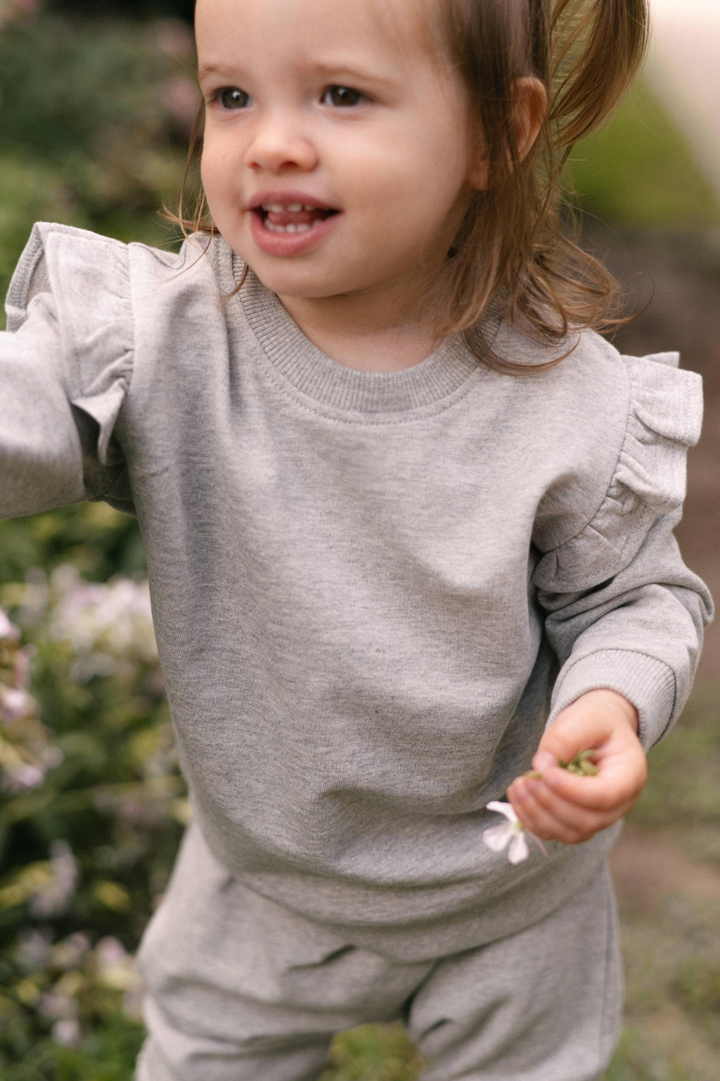 French Terry Toddler Ruffle Sweatshirt - Heather Grey- Front- Up Close- On Model