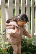 corduroy quilted jacket thistle in pinks pattern front of toddler with zipper