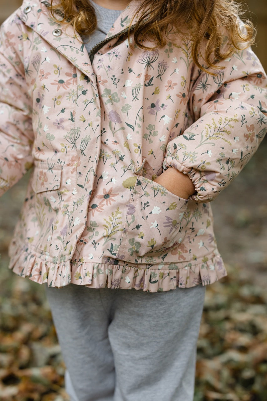 Sherpa Lined Storm Jacket with Ruffles - Wildflower- Toddler- Close Up- Toddler Hand in Front Pocket