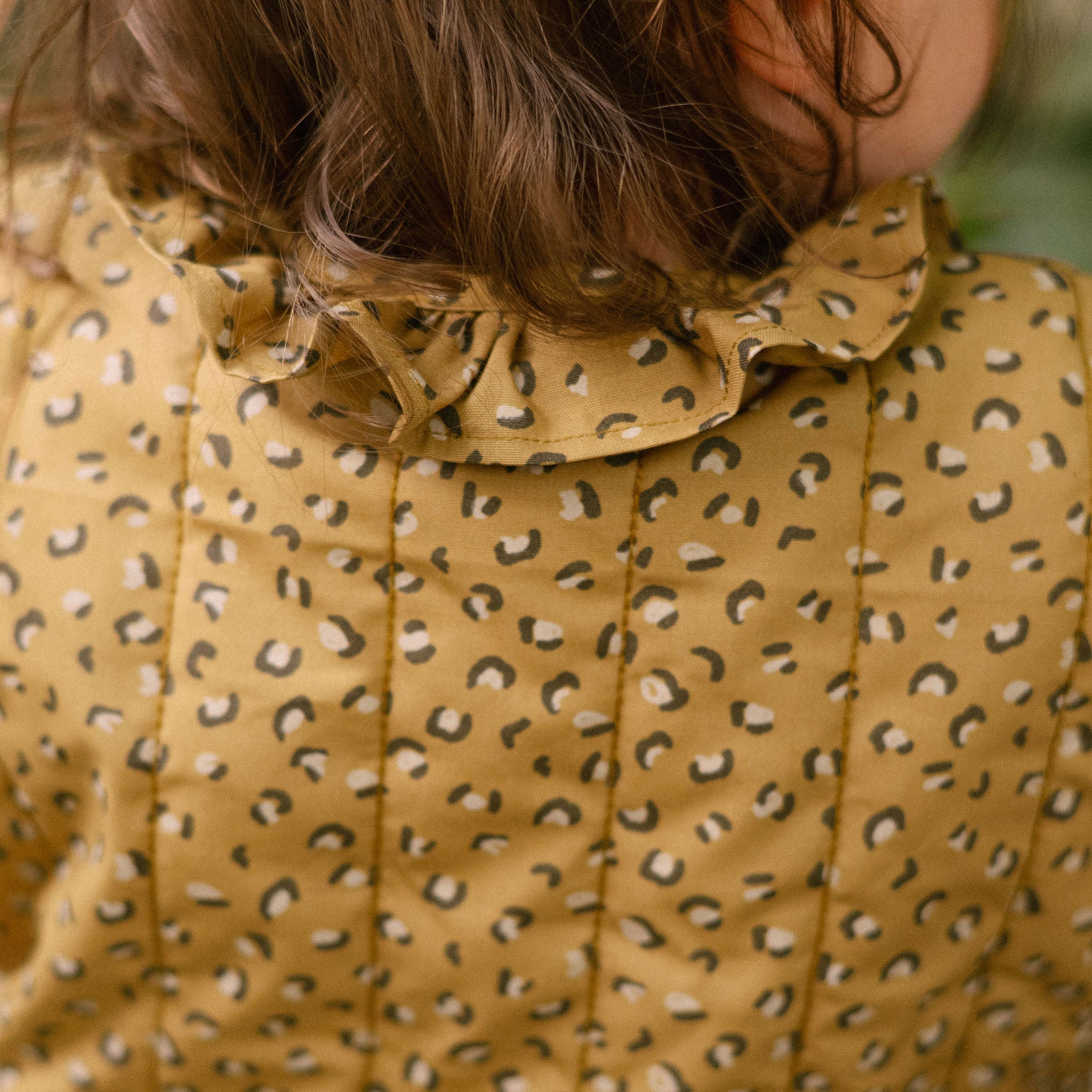 Coated Quilted Ruffle Jacket - Spotted- On Mode- Back- Up Close