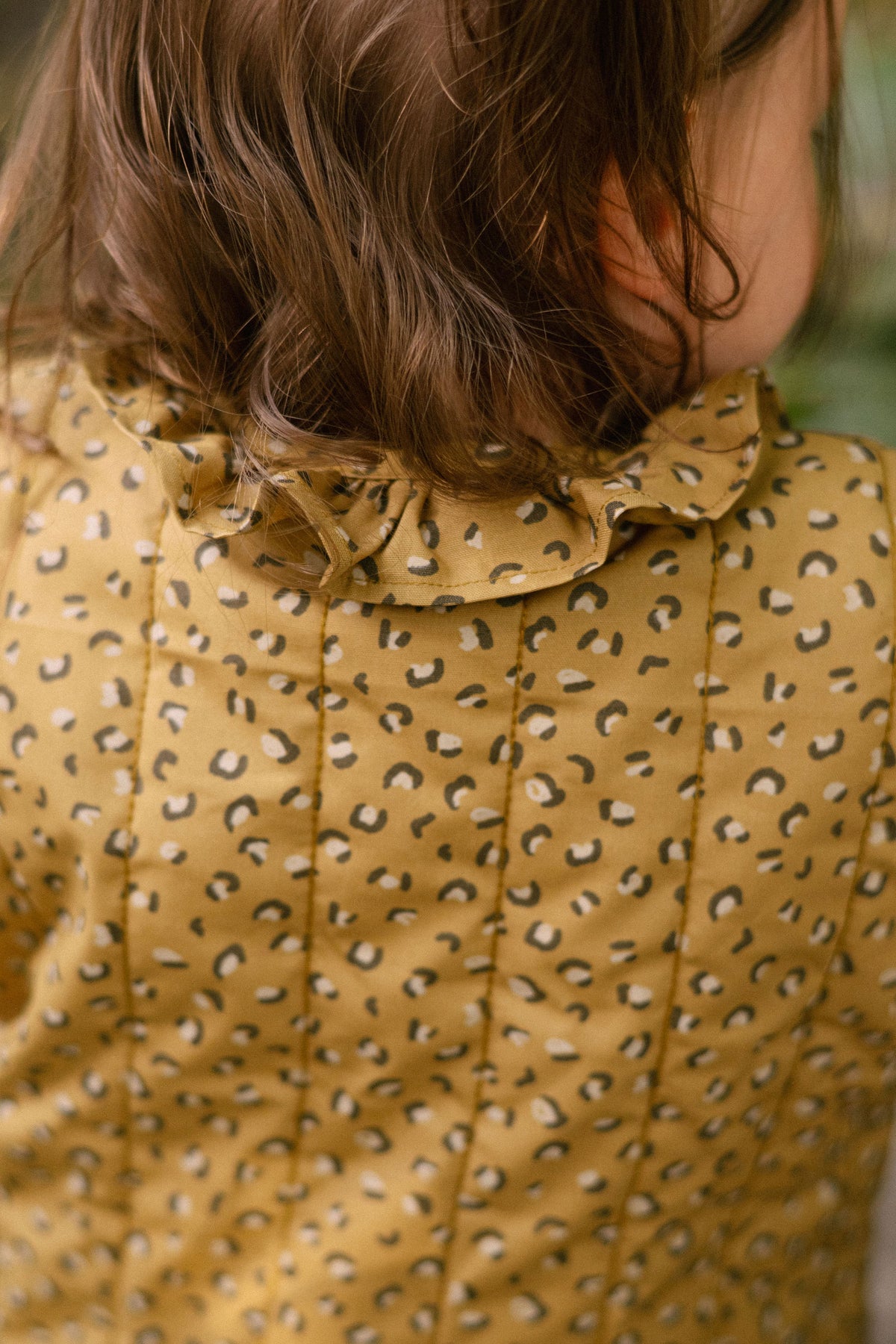 Coated Quilted Ruffle Jacket - Spotted- On Mode- Back- Up Close