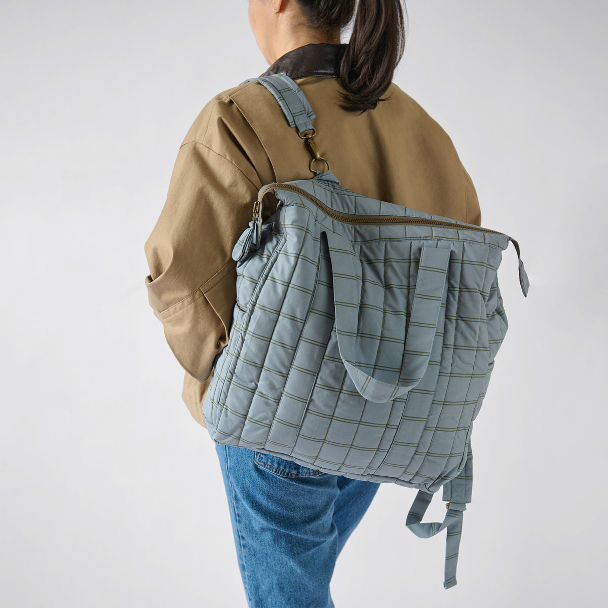 Windowpane- Convertible Diaper Bag- Model Wearing as Backpack
