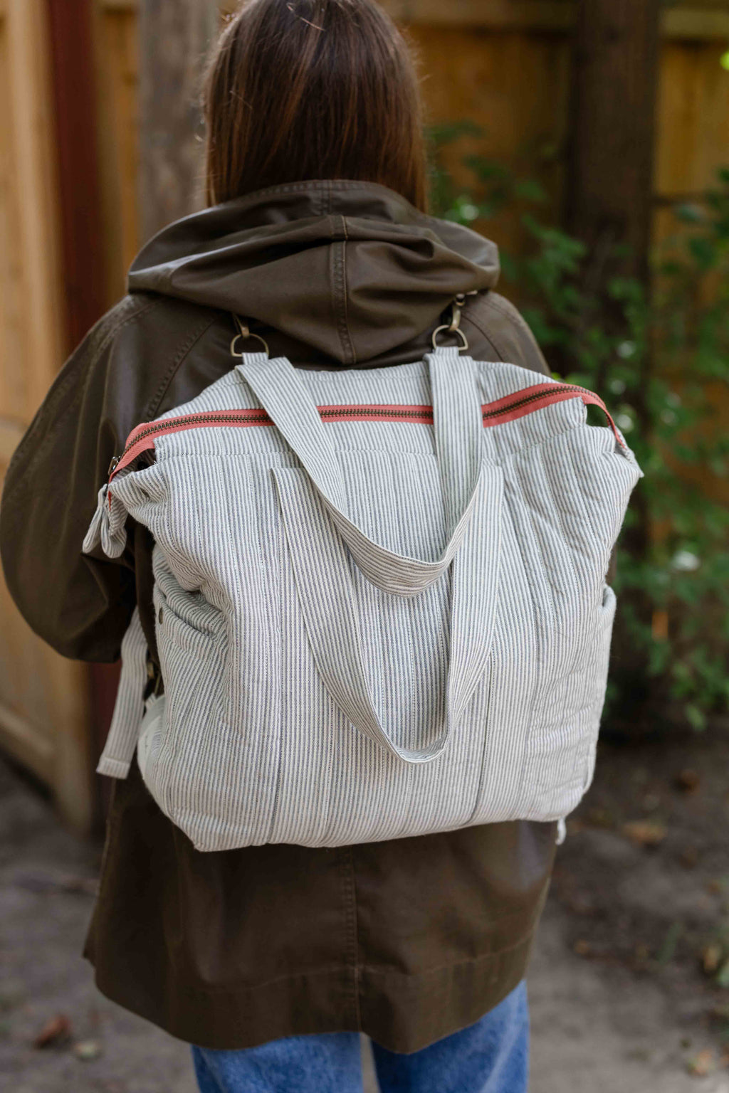 Railroad Convertible Diaper Bag- Model Wearing As Backoack