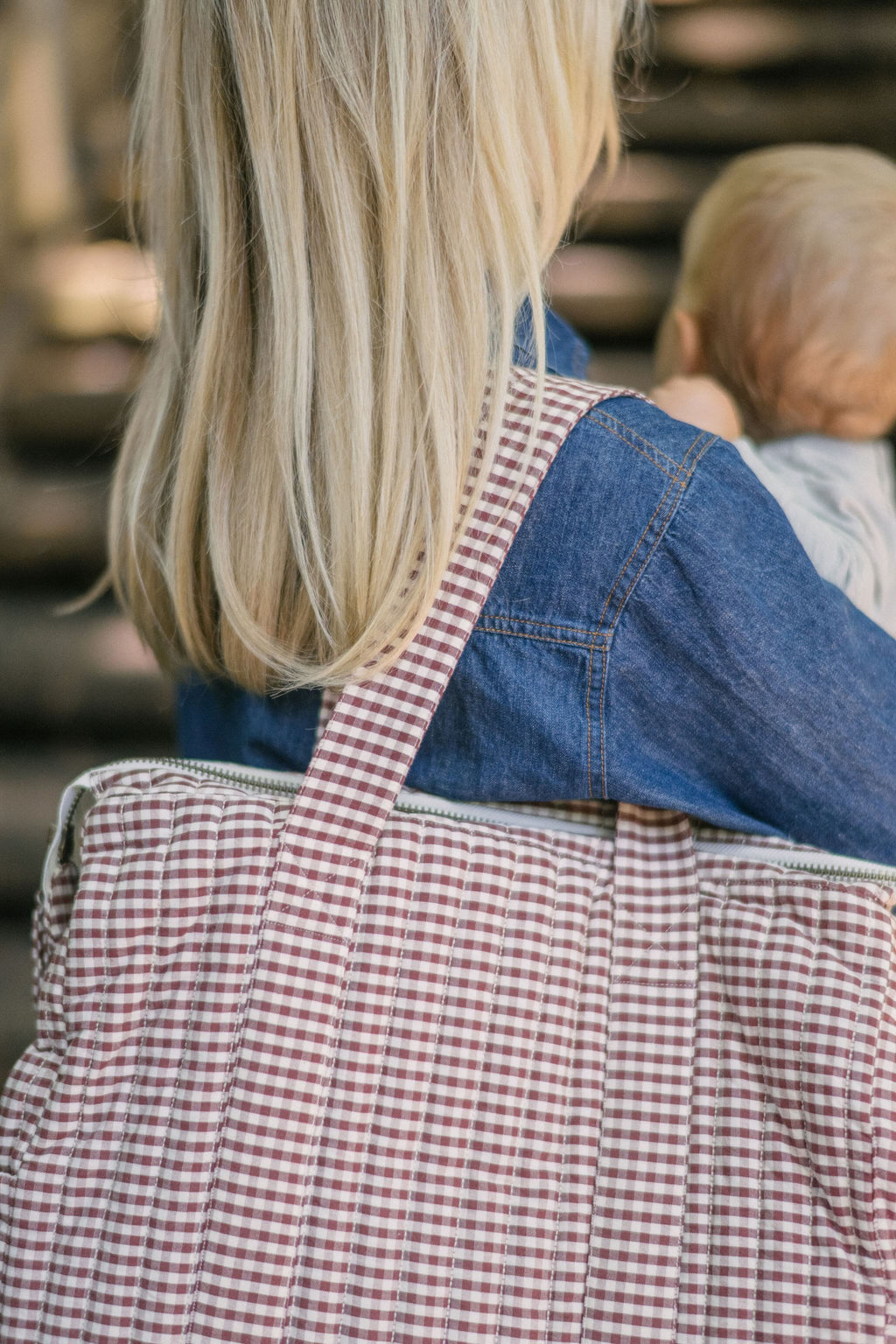 Gingham Convertible Diaper Bag - Mulberry- On Model Shoulder- Carrying Baby