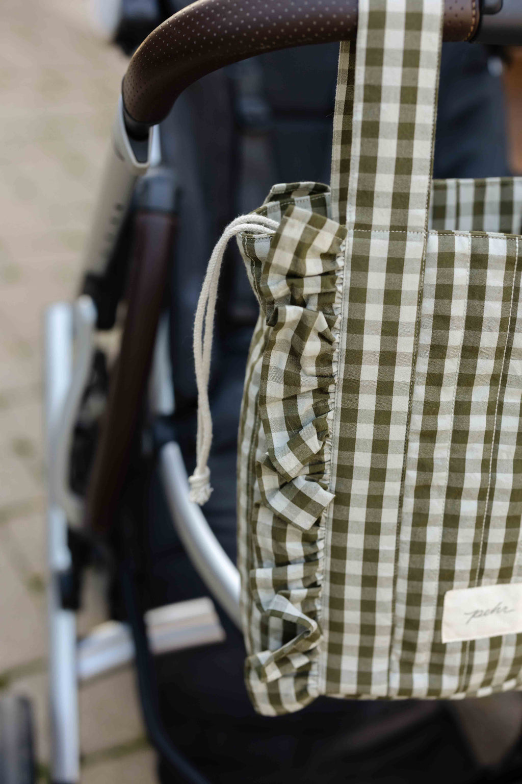 Stroller Bag - Sage/Pine- Up Close- Hanging On Stroller Bars